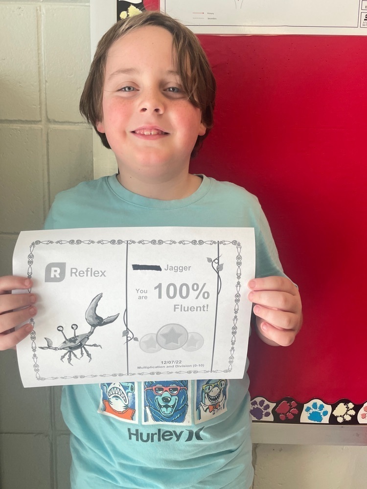 image of student, Jagger W  holding a reflex certificate 