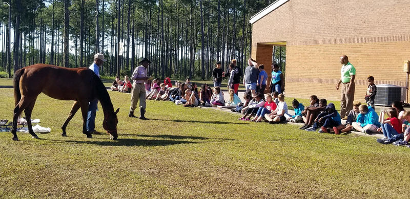 Cowboys visit students